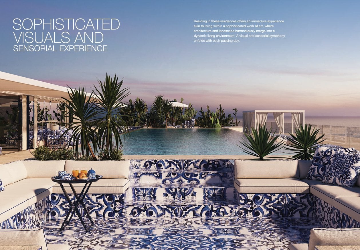 Terrass med majolika och infinity pool vid solnedgång