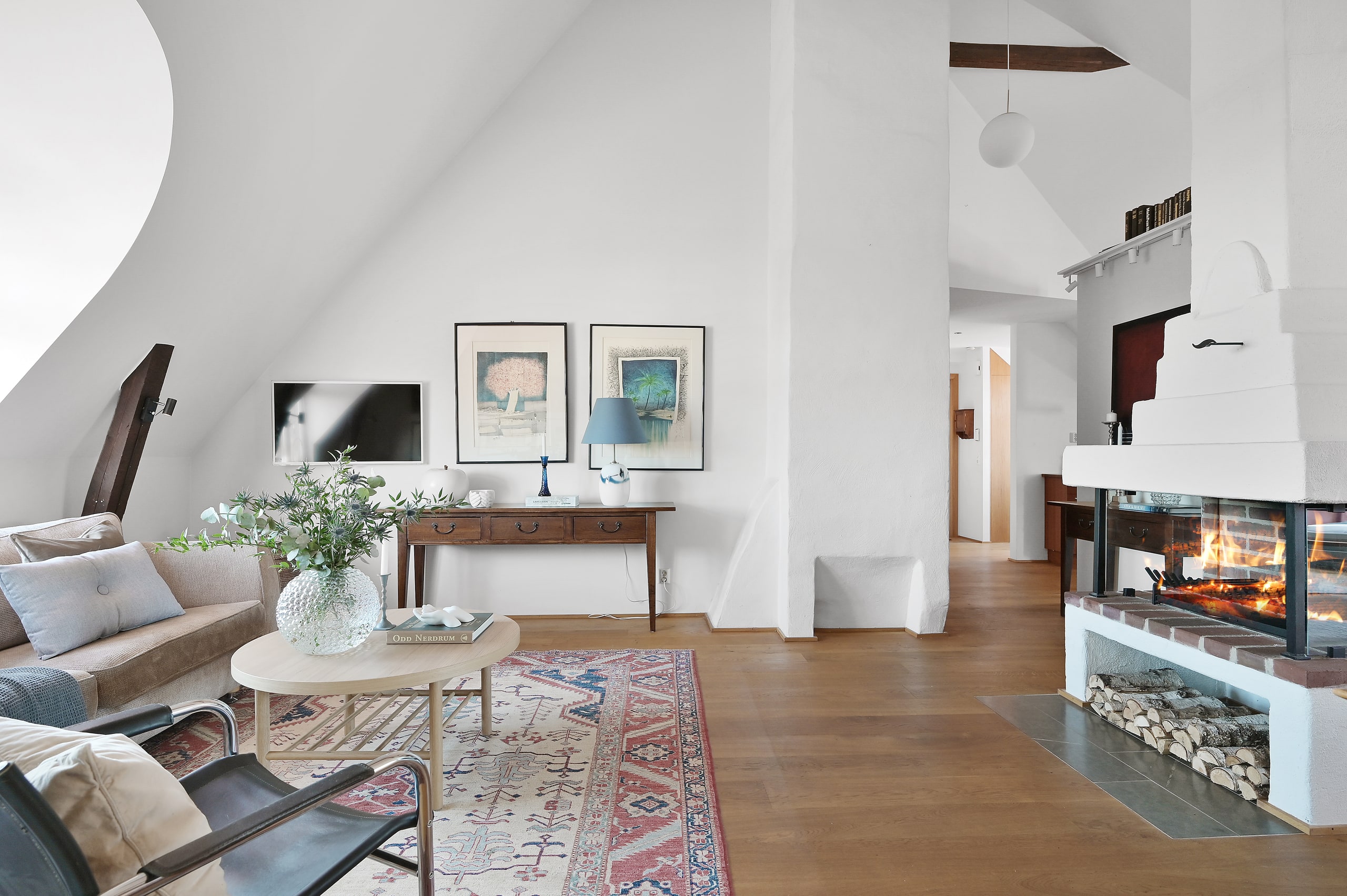 Bright living room with open fireplace
